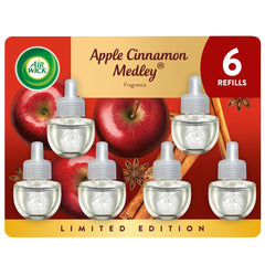 Air Wick plug-in refill Apple Cinnamon Medley pack enhances cozy autumn ambiance in living rooms.