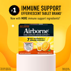 Airborne zesty orange effervescent drink dissolving with citrus aroma.