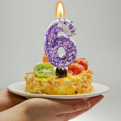 AKURIEEY glitter-number candle adds sparkle to birthday cakes.