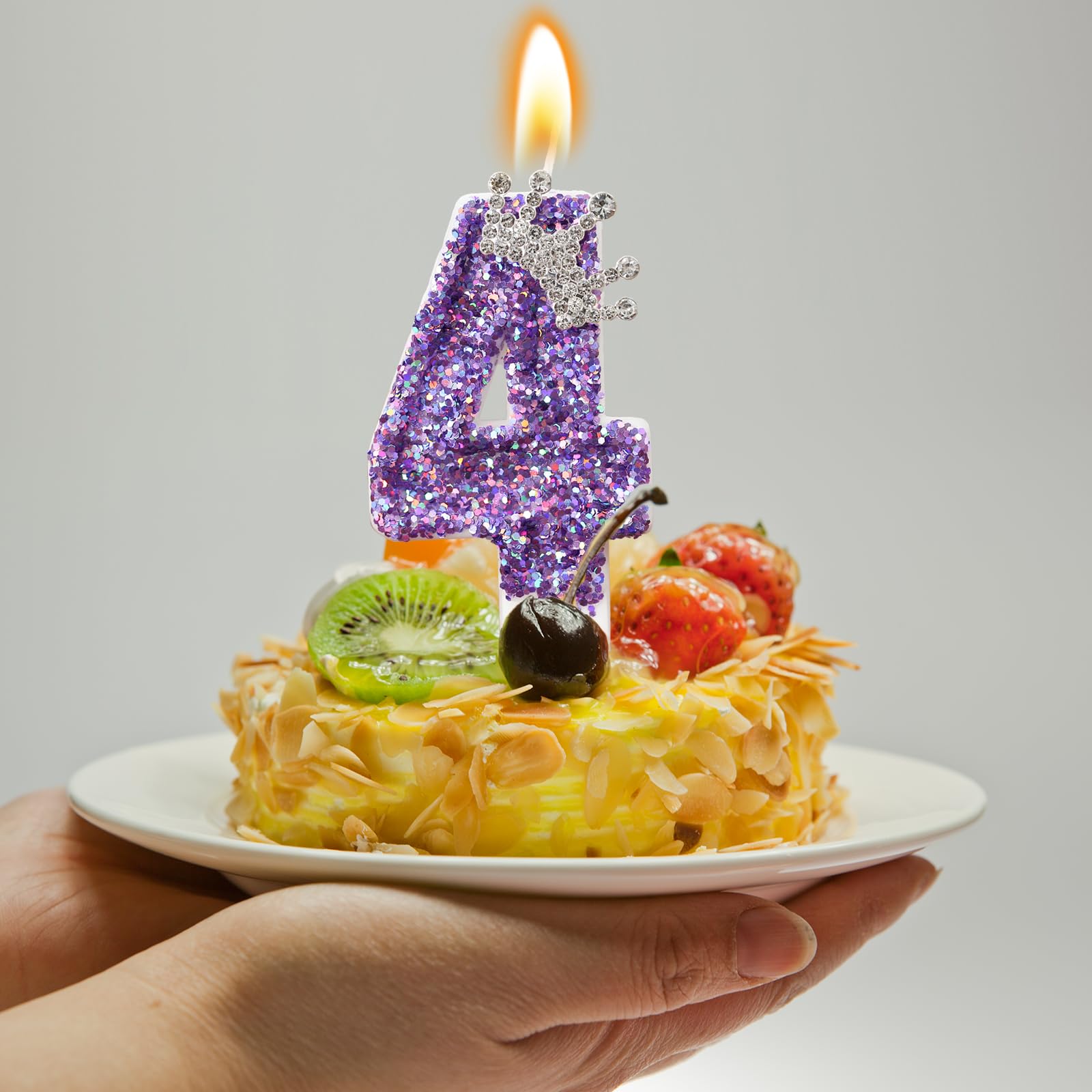 AKURIEEY purple crown detail on candle enhancing luxury party aesthetics