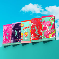 Alani Nu Pink Slush Energy Sticks dissolving in water for quick flavor and energy.