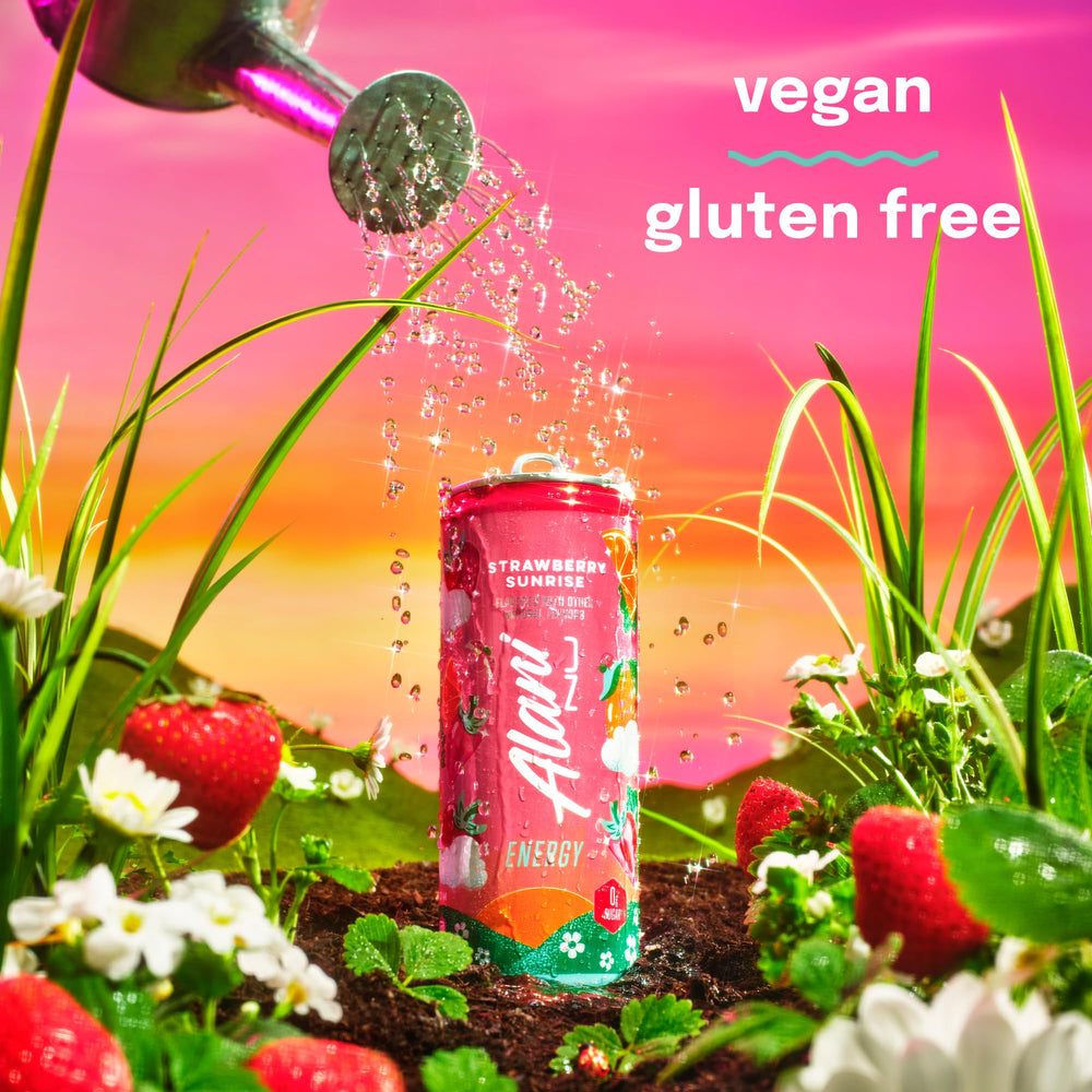 Glass of Alani Nu Strawberry Sunrise with bubbles, a refreshing low-calorie routine companion.