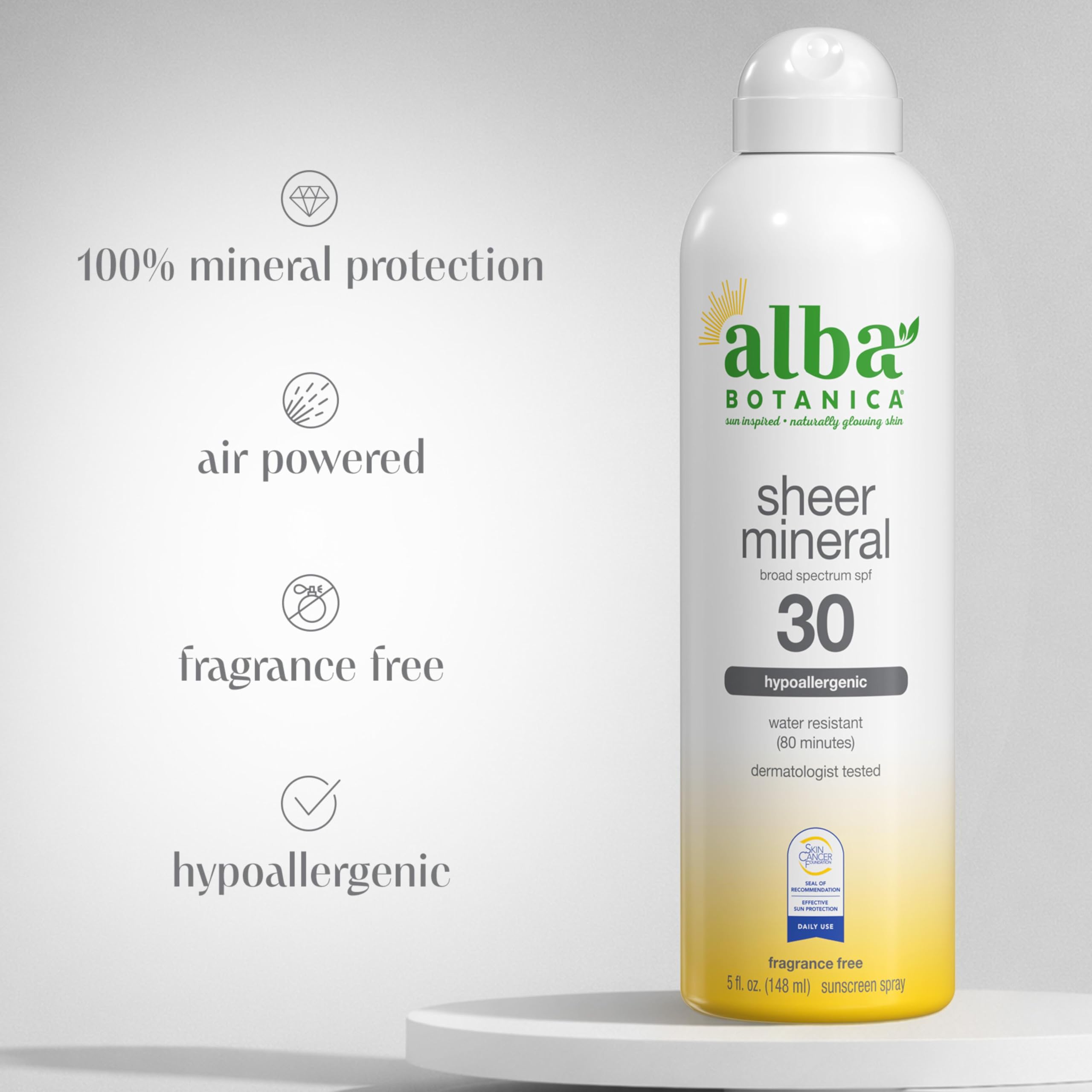 Woman applying Alba Botanica sunscreen spray for quick, light coverage.