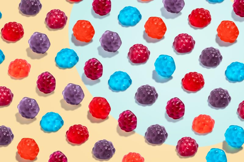Albanese mixed berry flavors collection showing cherry, strawberry, grape gummies.