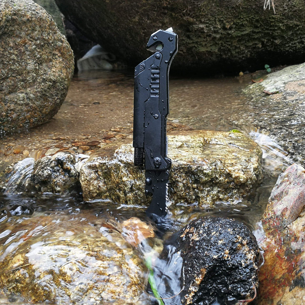 ALBATROSS 6-in-1 survival knife with magnesium fire starter for sparks.