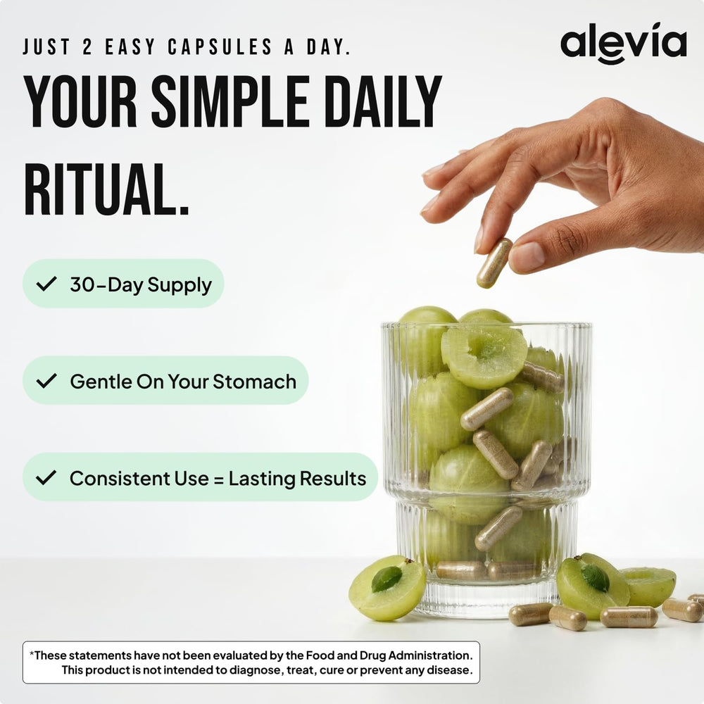 Alevia amla capsules in bottle with spoon for daily wellness
