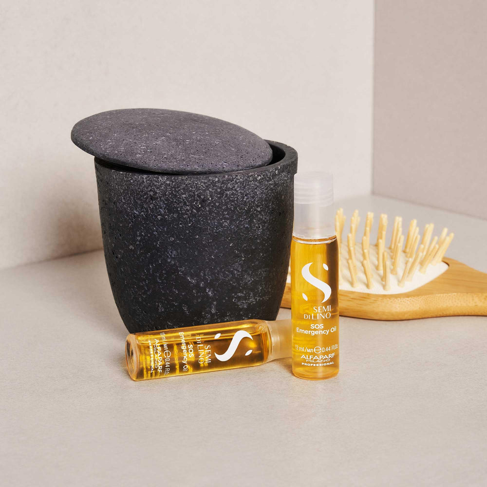 Packaging box of ALFAPARF MILANO Reconstruction highlights vegan and color-safe formulas.