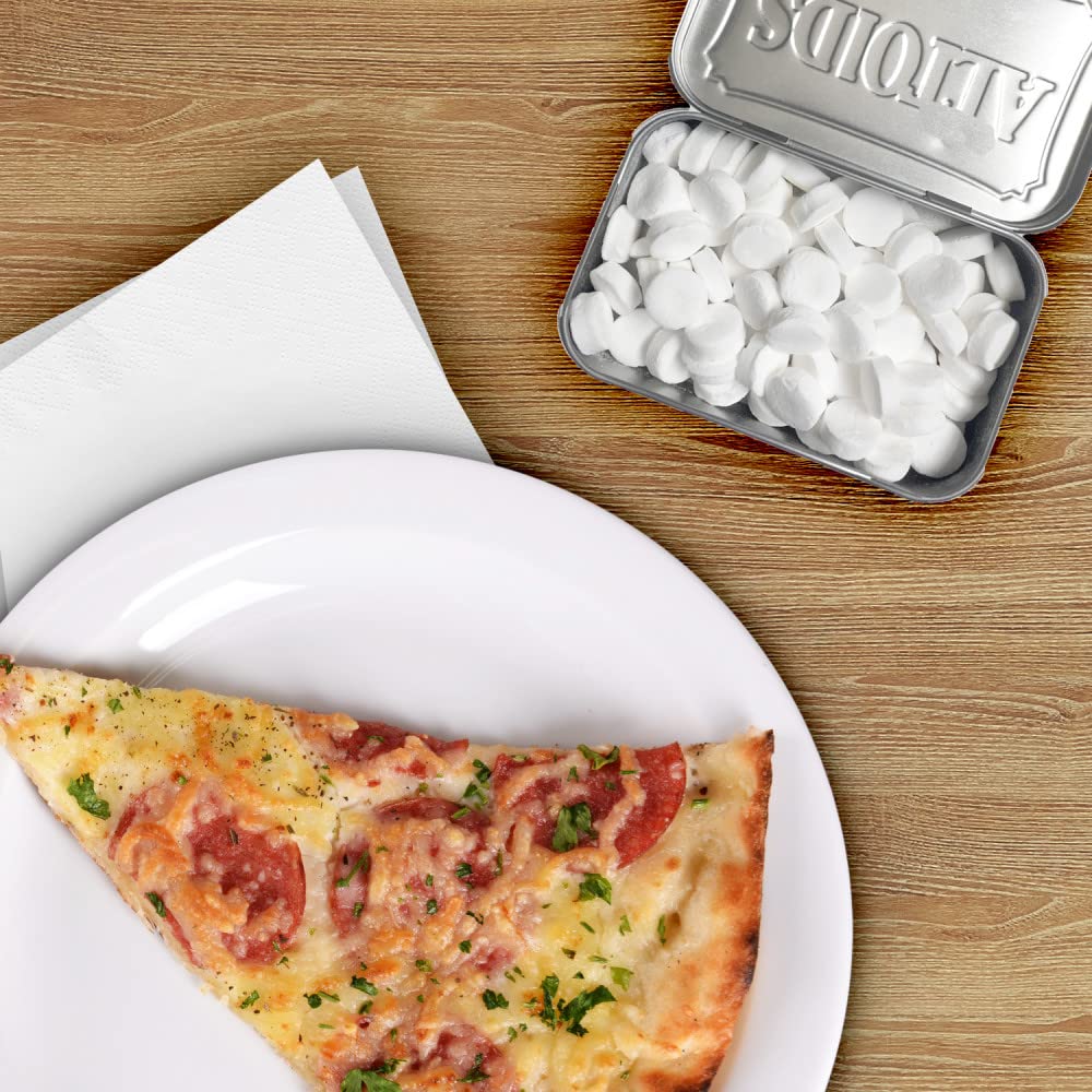 Altoids classic peppermint tin open showing curiously strong flavor