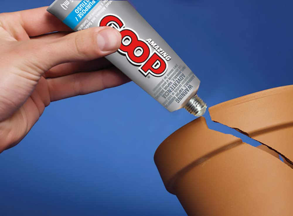 Amazing GOOP clear adhesive spread on wood for a flexible seal.