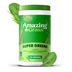 Amazing Grass Greens Blend green powder scoop beside a glass of water for quick mix.