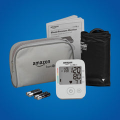 Amazon Basic Care BP monitor showing hypertension indicator during measurement.