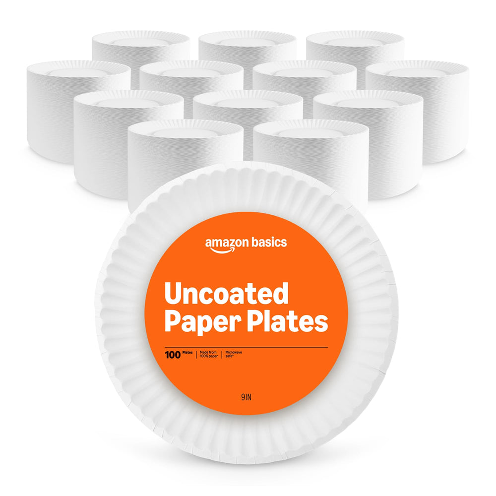 Amazon Basics 9in uncoated white paper plates stacked for easy serving.