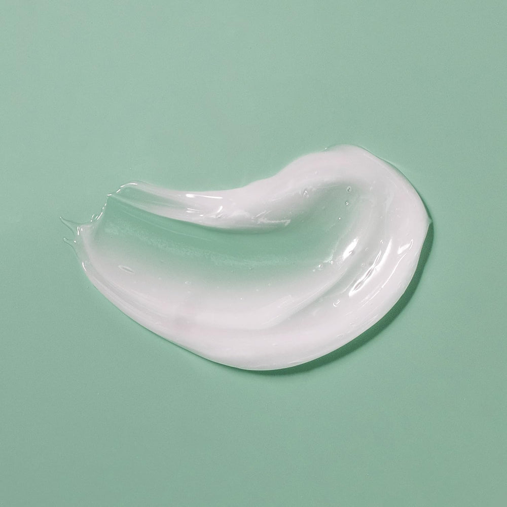 Amazon Basics Acne Cream Cleanser close-up of texture and 4% benzoyl peroxide information.