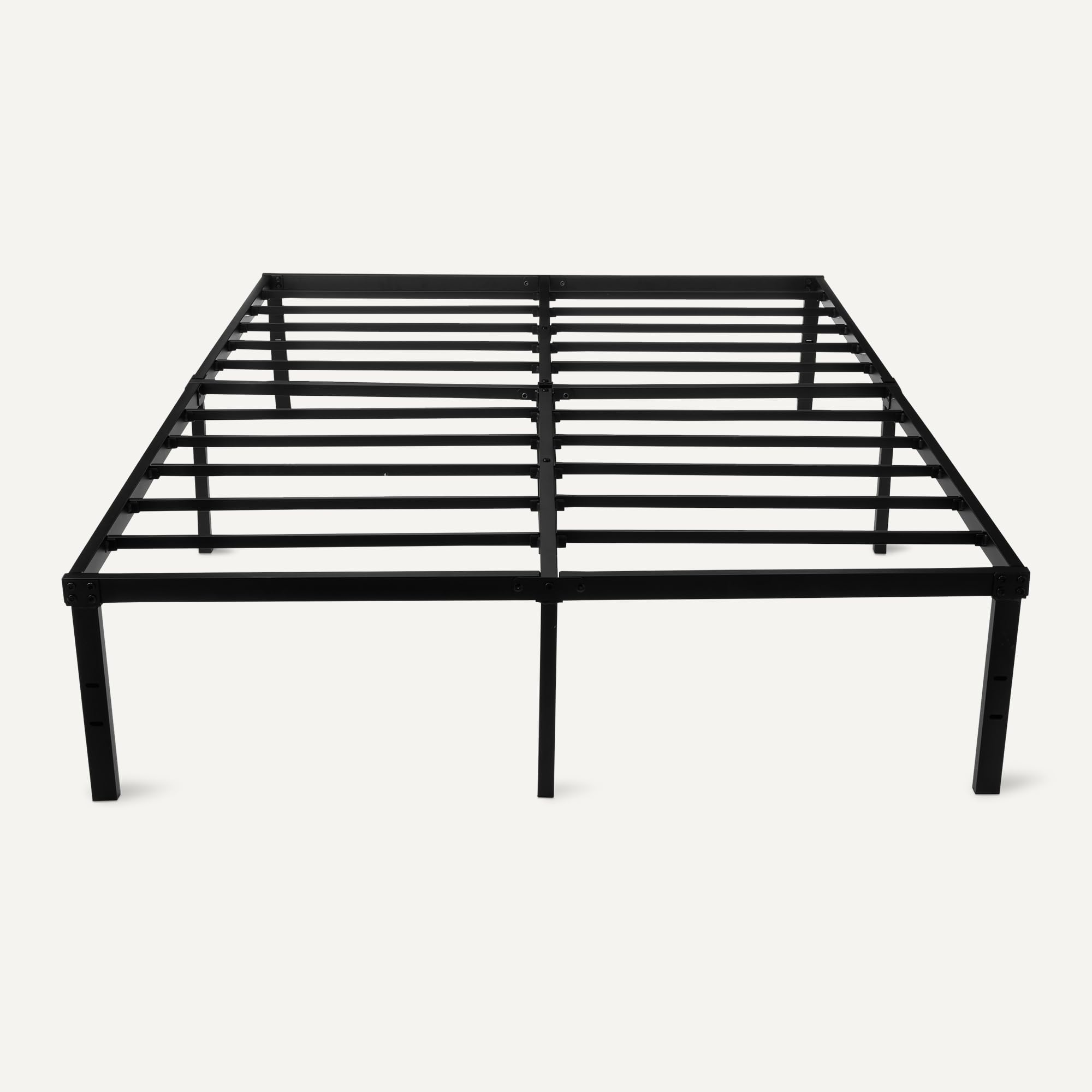 Amazon Basics bed frame assembly with included tools for quick setup.