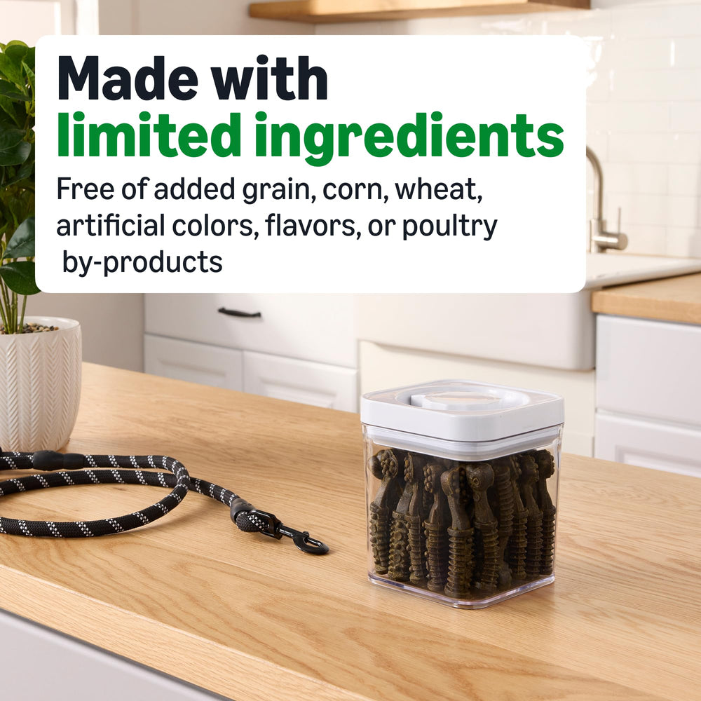 Chews in dog's mouth from Amazon Basics illustrating cleaning action.
