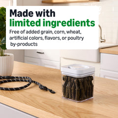 Chews in dog's mouth from Amazon Basics illustrating cleaning action.