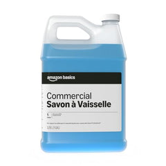 Two gallon bottles of Amazon Basics liquid dish soap on a prep area.