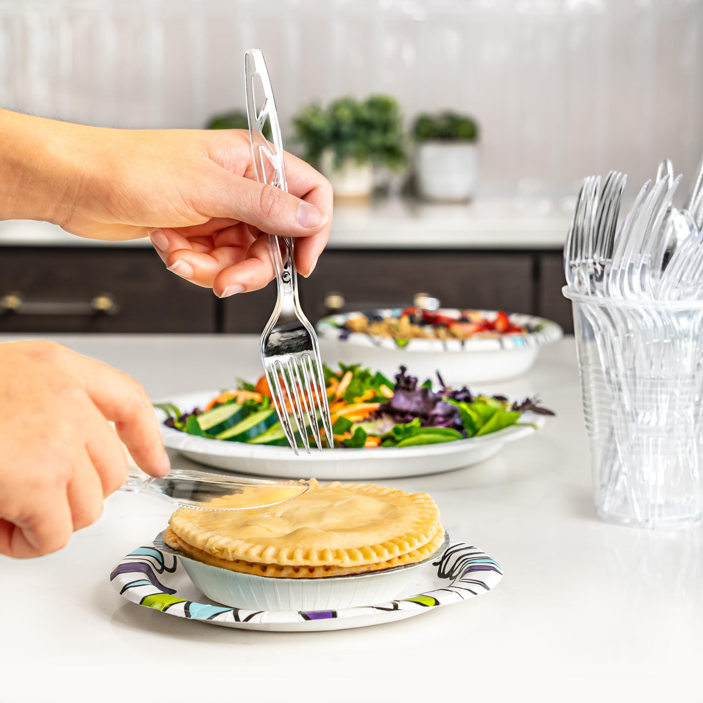 Amazon Basics disposable clear cutlery packaging, ready for quick restocking and easy storage.