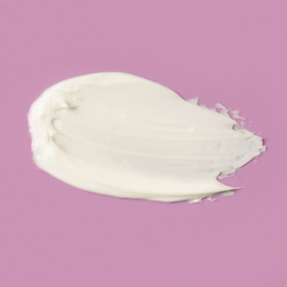 Amazon Basics firming cream applied evenly to face and neck.