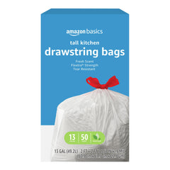 Amazon Basics Flextra Strength tall 13-gallon trash bags showing tear resistance for heavy waste