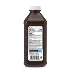 Amazon Basics bottle with cap pouring for easy application.