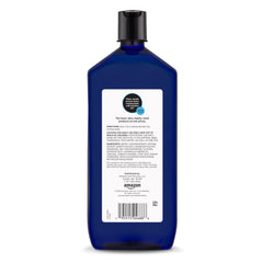 Pouring Amazon Basics Lavender Scented Foaming Bath foam into warm water for a calming soak.