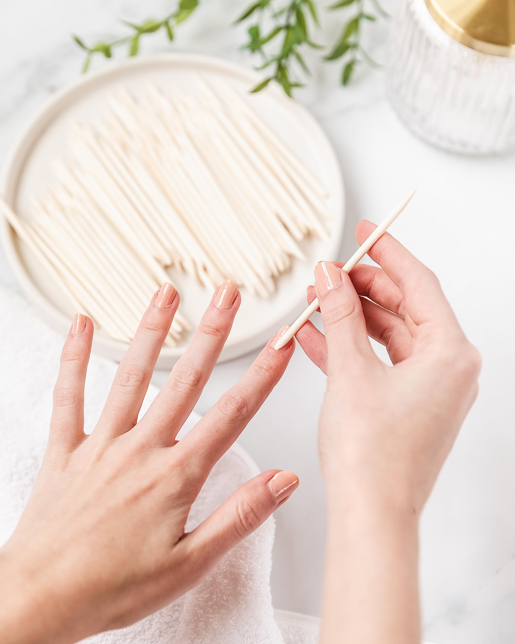 Orange color highlights easy identification of Amazon Basics manicure sticks.