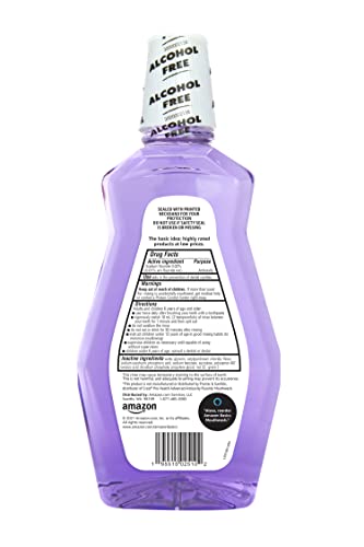 Pouring Amazon Basics mouthwash into a cup for a quick morning routine