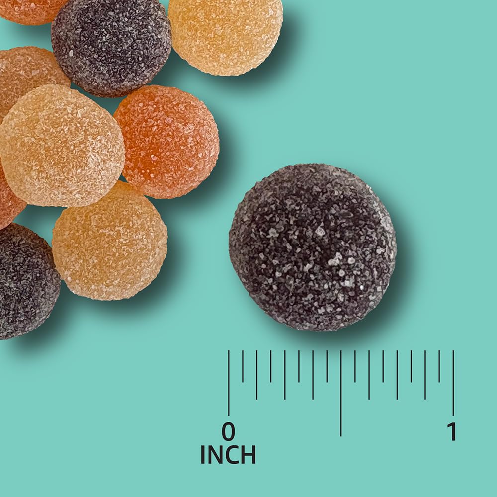 Amazon Basics Probiotic Gummies colorful flavors shot; lemon, orange, mixed berry.