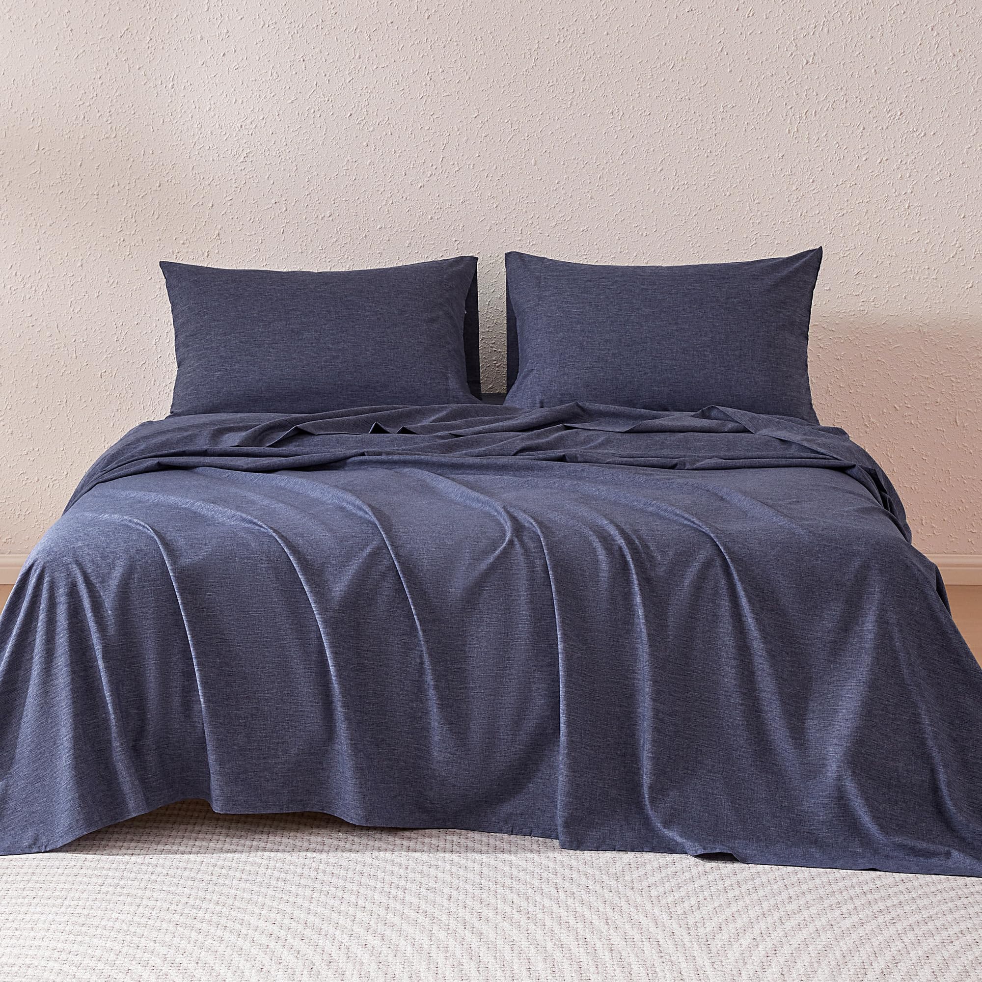 Amazon Basics blue fitted sheet with deep pocket ensures secure, wrinkle-free fit.