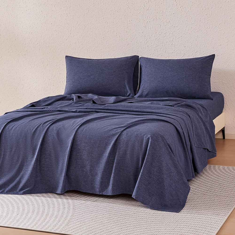 Amazon Basics blue flat sheet shows silky softness and easy care.