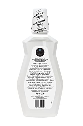 Amazon Basics Teeth Whitening Mouthwash pour captures a quick rinse and minty freshness.