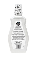 Amazon Basics Teeth Whitening Mouthwash pour captures a quick rinse and minty freshness.