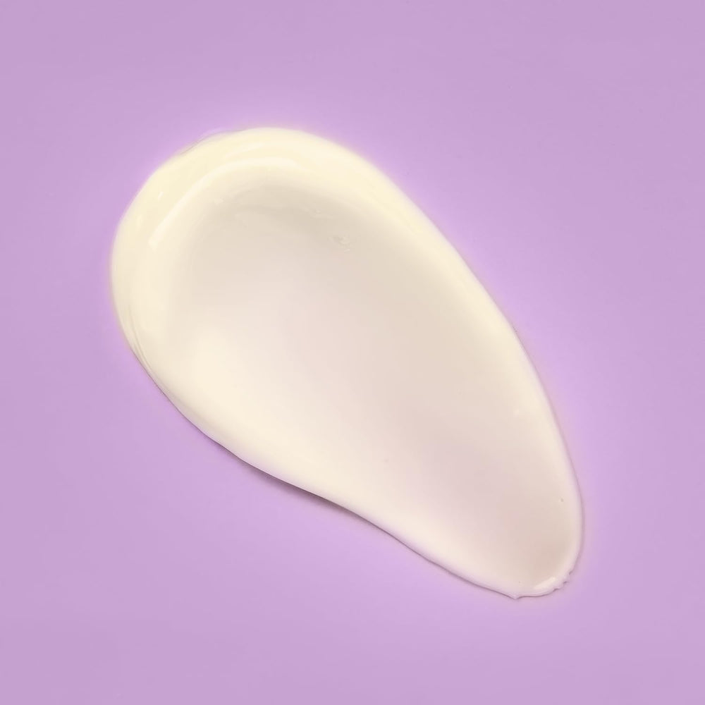 Gently massaging the cream onto face and neck in use