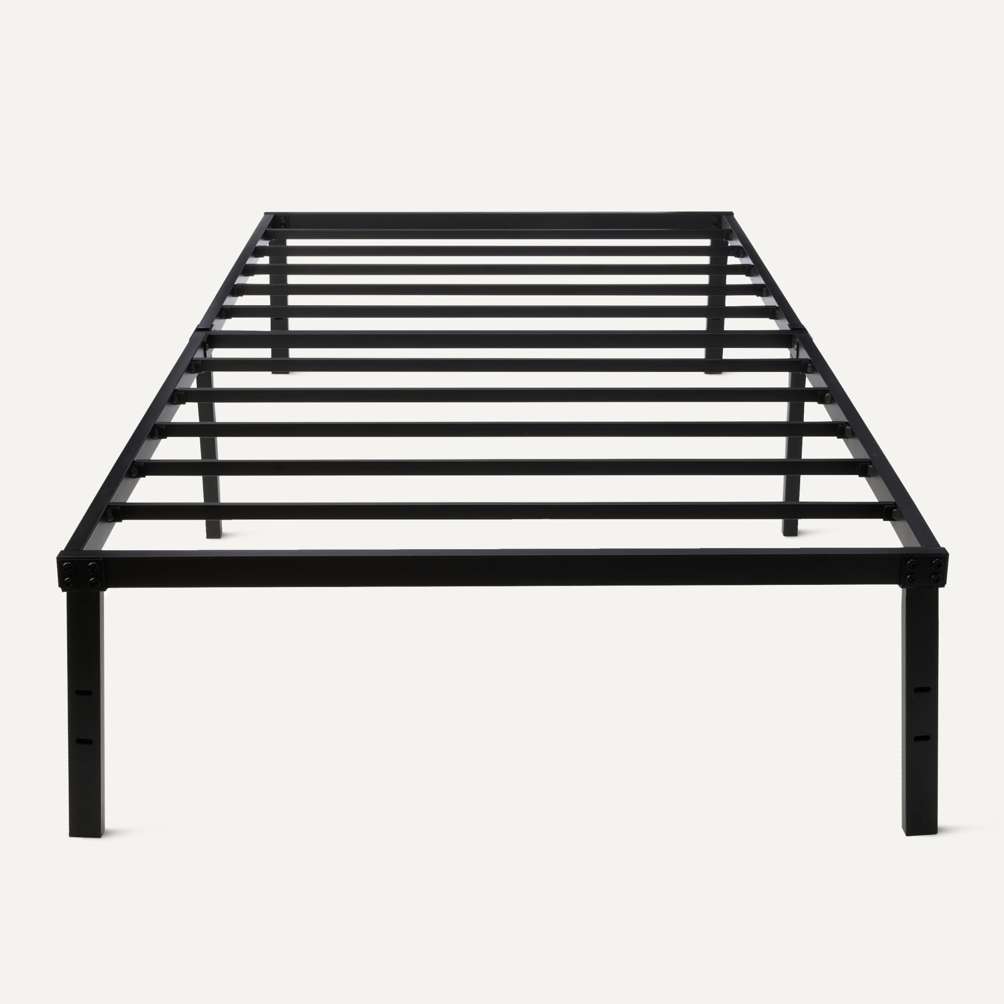 Amazon Basics bed frame with protective floor pads preventing floor scratches.