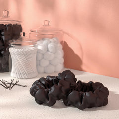 Amazon Basics satin scrunchies in a bun minimize breakage and snagging.