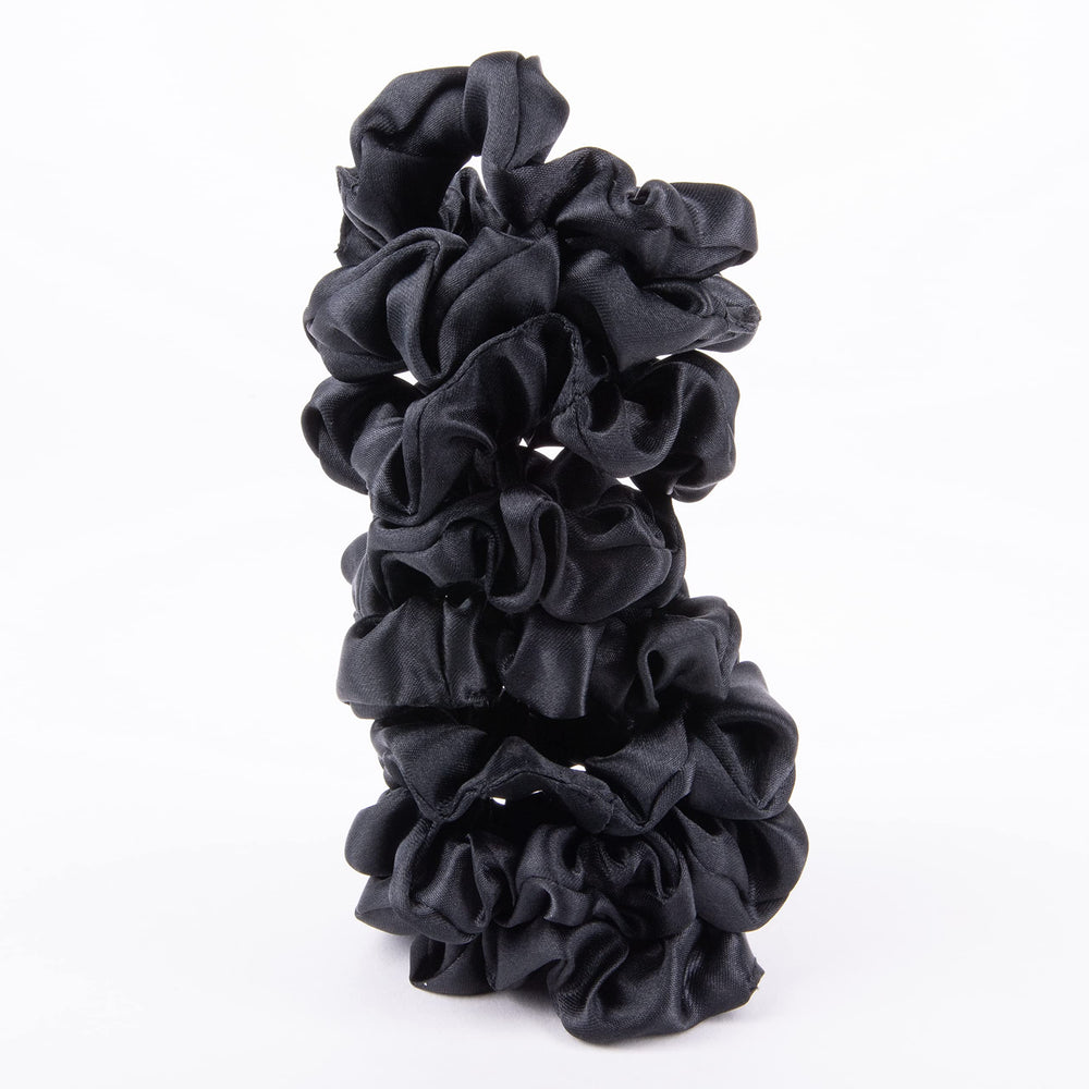 Amazon Basics satin scrunchies for overnight wear may reduce morning frizz.