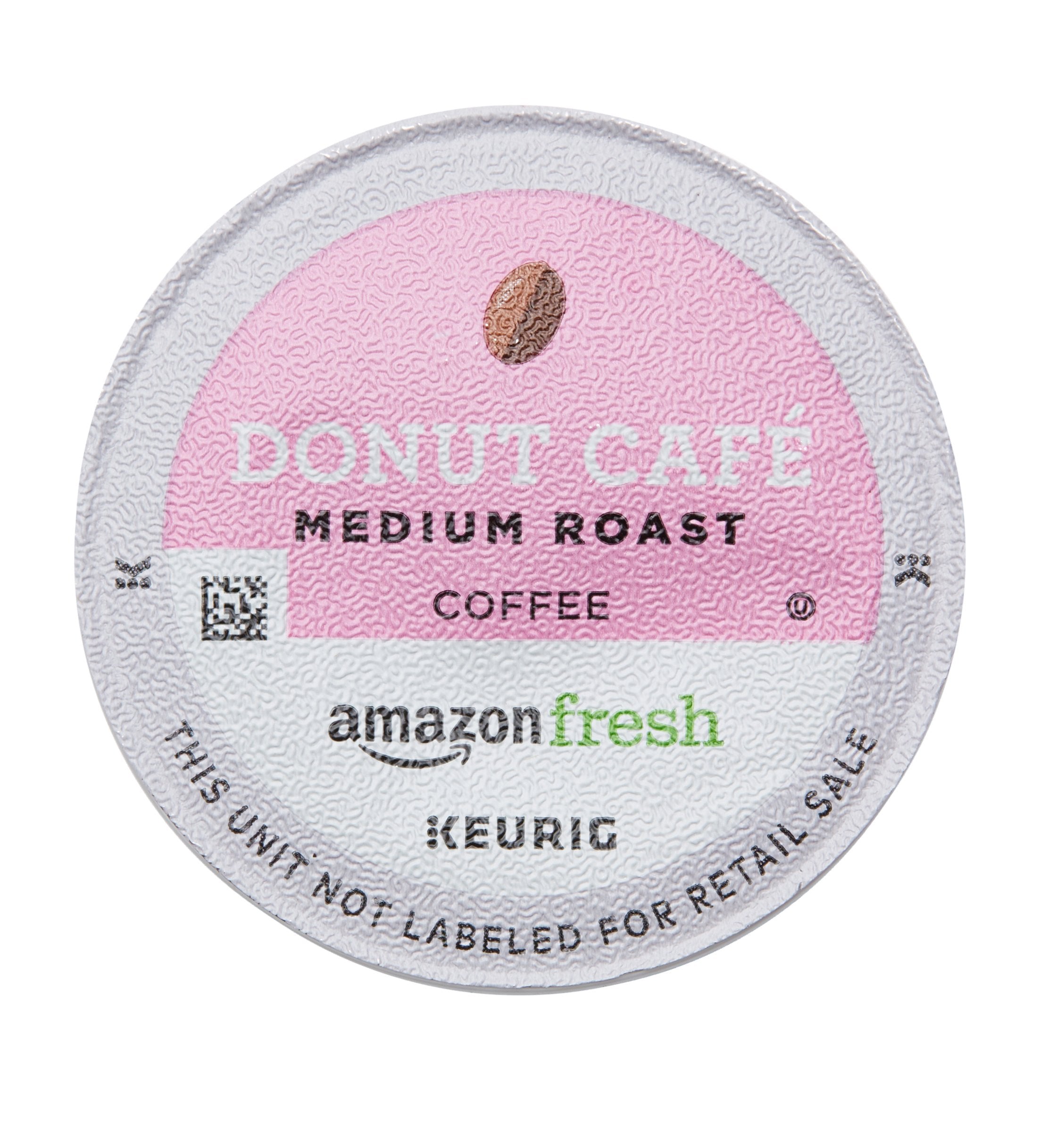 Amazon Fresh brand logo on packaging signals reliable, easy brewing.