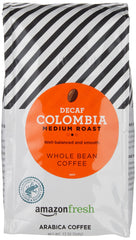 Amazon Fresh Decaf Colombia whole bean 3-pack on counter for convenient mornings.