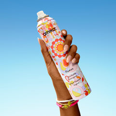 Amika Fluxus Touchable Hairspray mist demonstrates ultra-dry spray and effortless control.