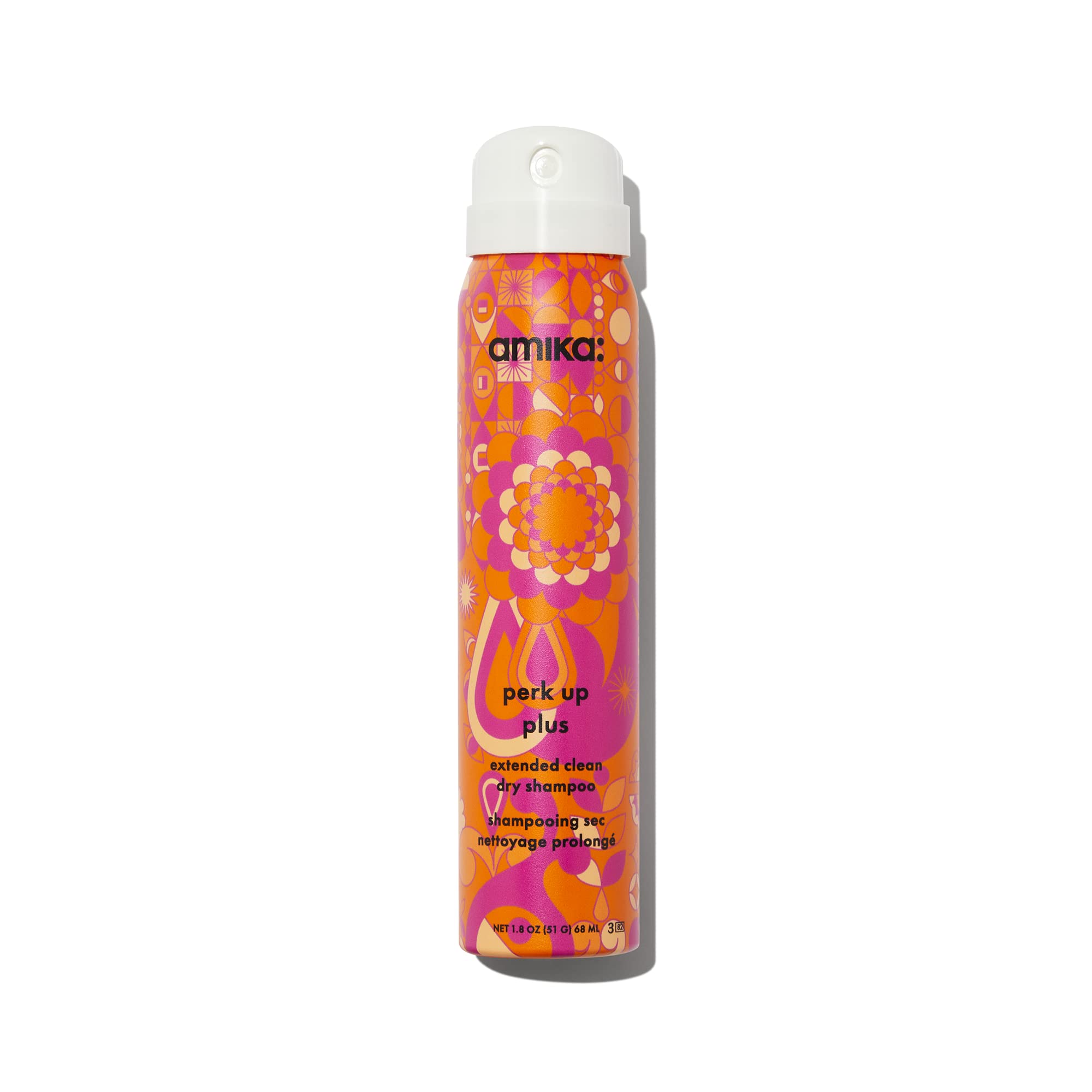 Amika Perk Up Plus bottle being poured for quick refresh.