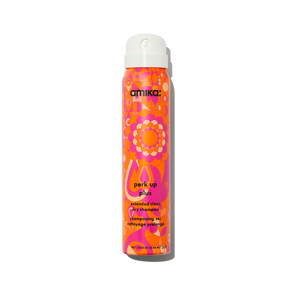 Amika Perk Up Plus bottle being poured for quick refresh.