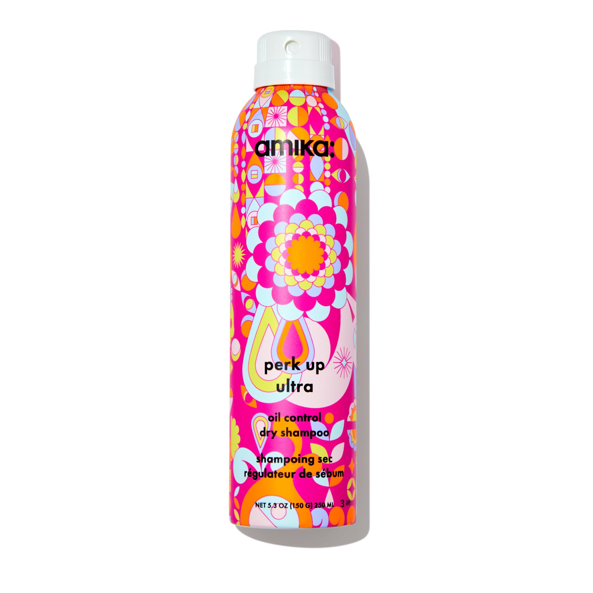 Amika Perk Up Ultra Dry Shampoo bottle pouring to control oil and refresh roots.