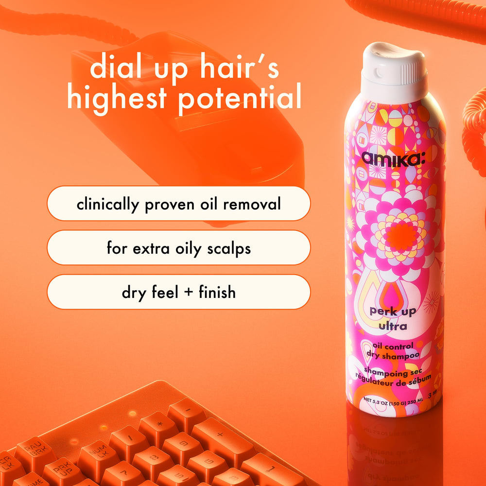 Amika Perk Up Ultra Dry Shampoo spray nozzle dispenses product for quick root refresh.