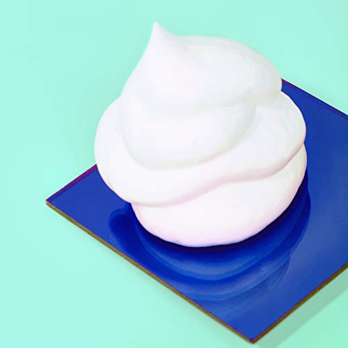 Amika Plus Size Perfect Body Hair Mousse dispensed onto palm for airy texture.