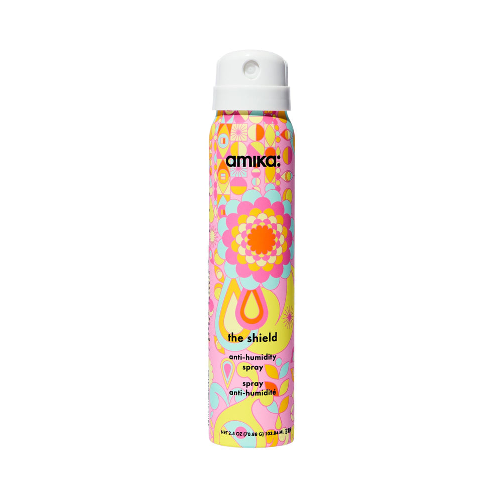 Amika The Shield bottle, front view, showcasing lightweight heat protection for hair.
