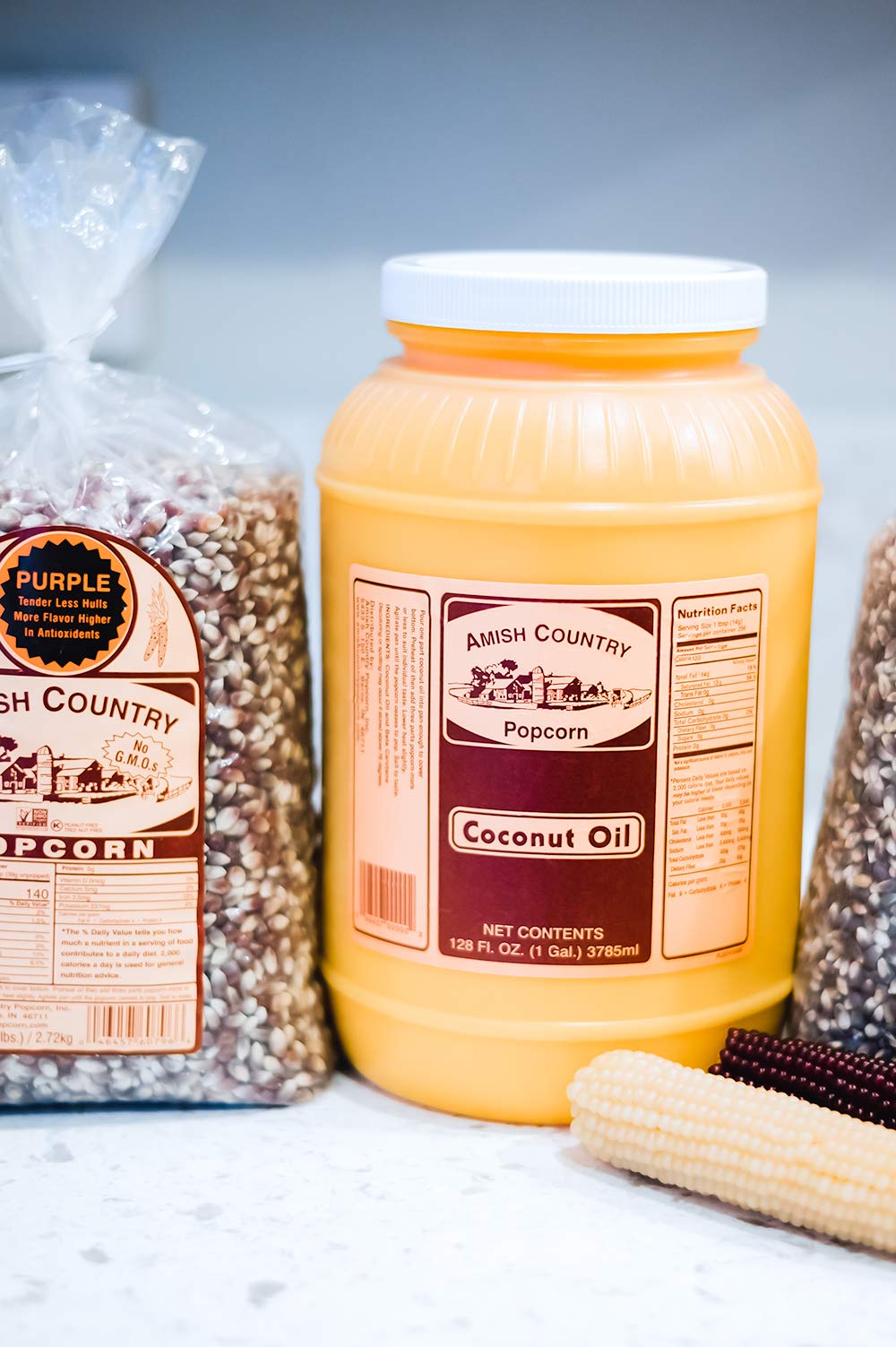 Amish Country Popcorn coconut oil 1 gallon pouring into popcorn popper.