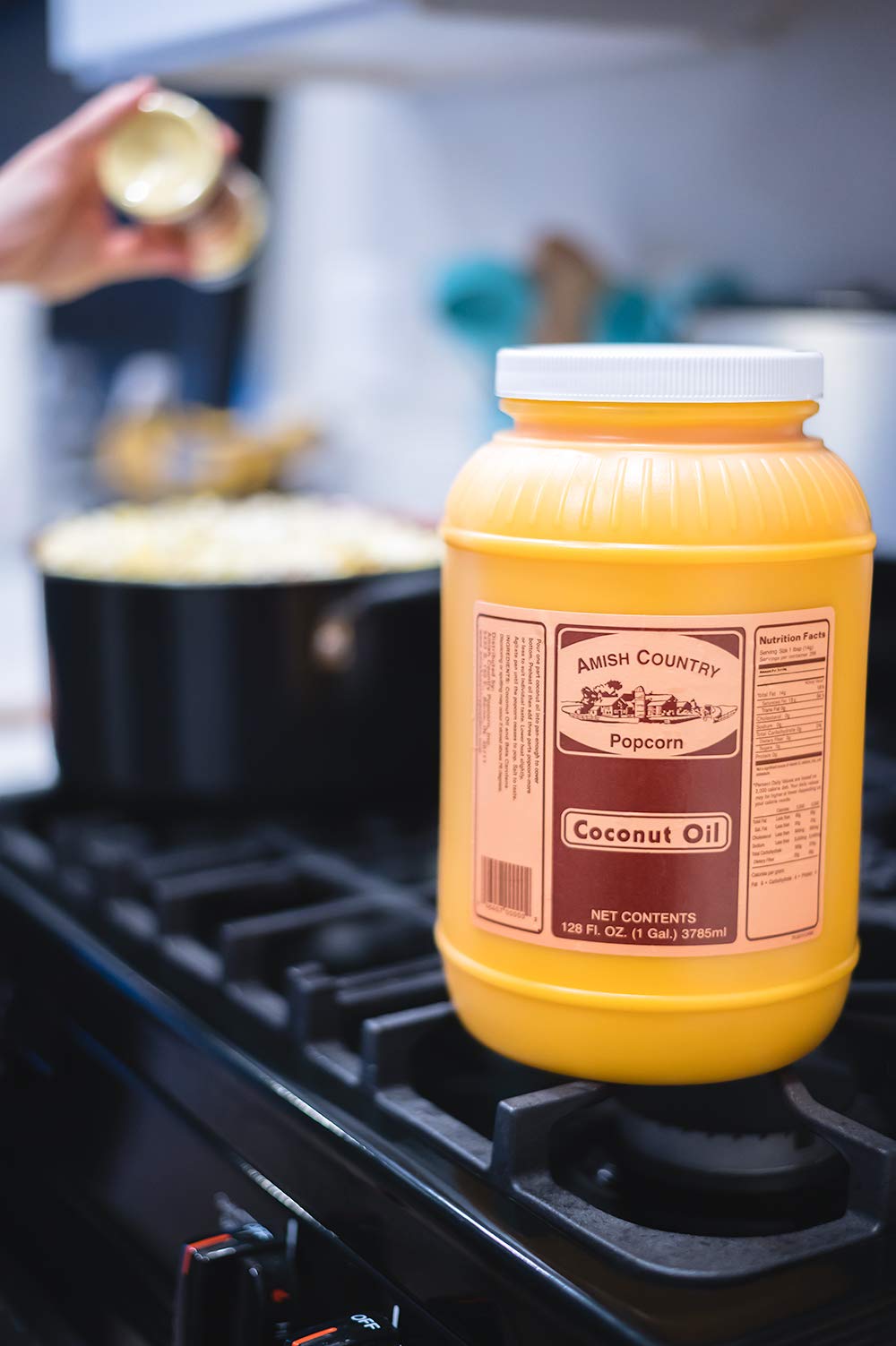 Amish Country Popcorn non-GMO gluten-free label on coconut oil jar.