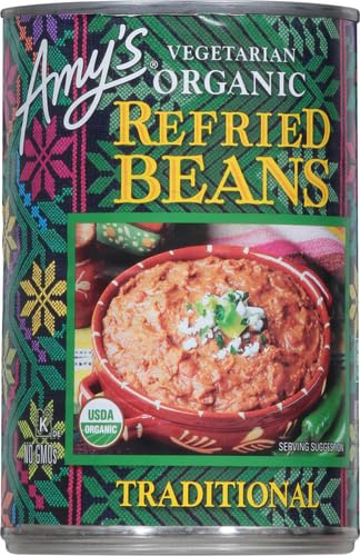 Amy's Organic Refried Beans spoon in dish, showing creamy texture for toppings.