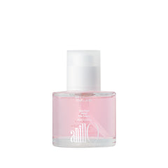 ANILLO Rosy Night Repair bottle pouring for instant shine and nourished hair.